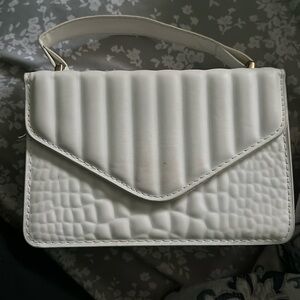White alligator lined purse